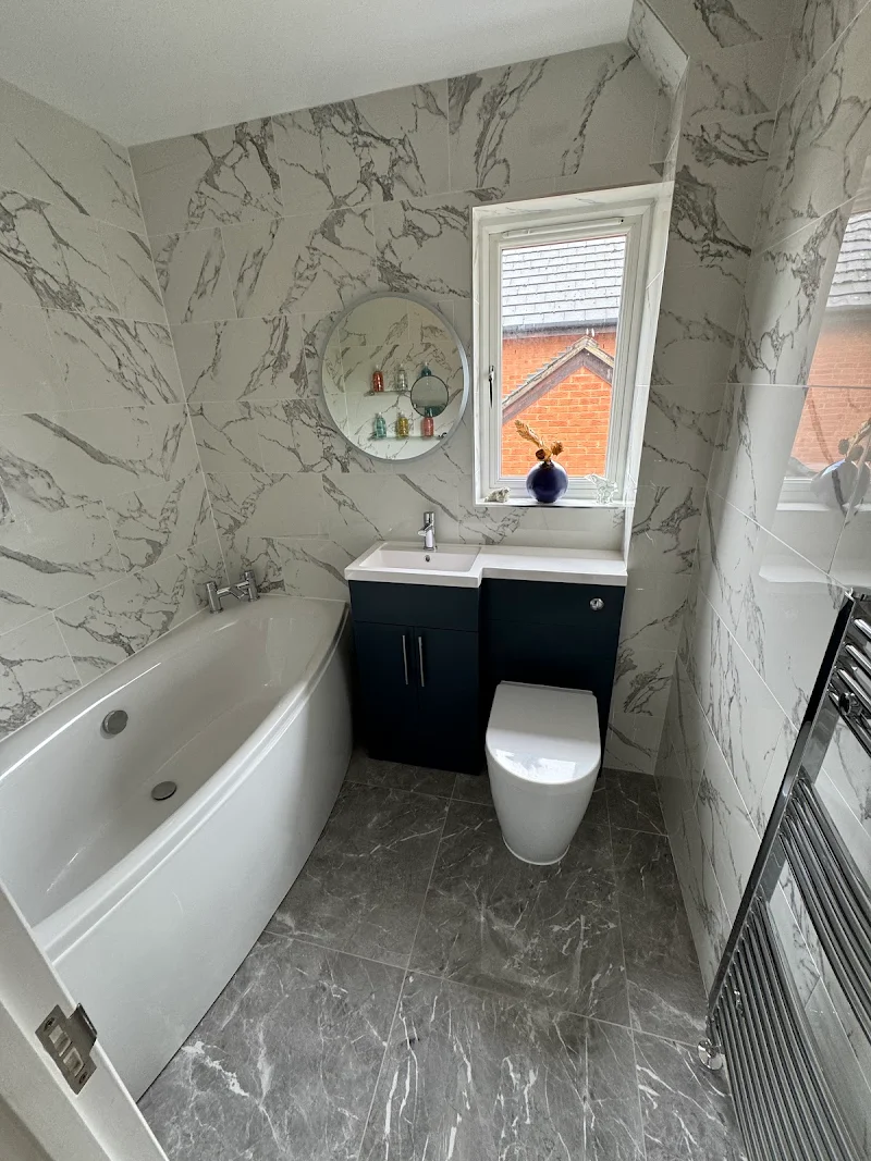 Marble tiled bathroom with bath